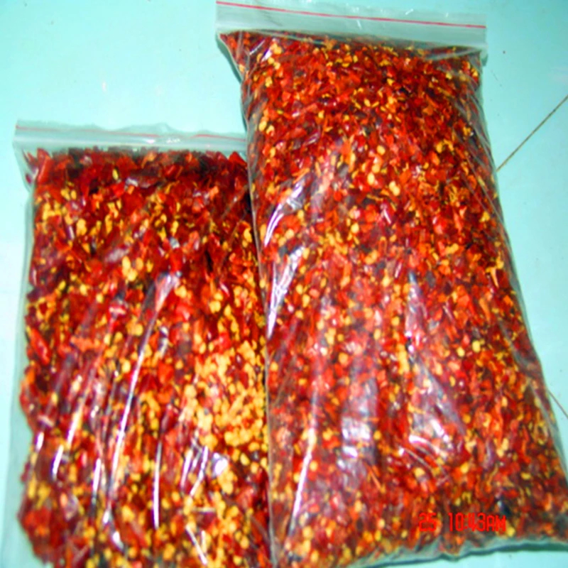 Lebhafte rote Chilli-Pfefferflocken zur Farbgewinnung